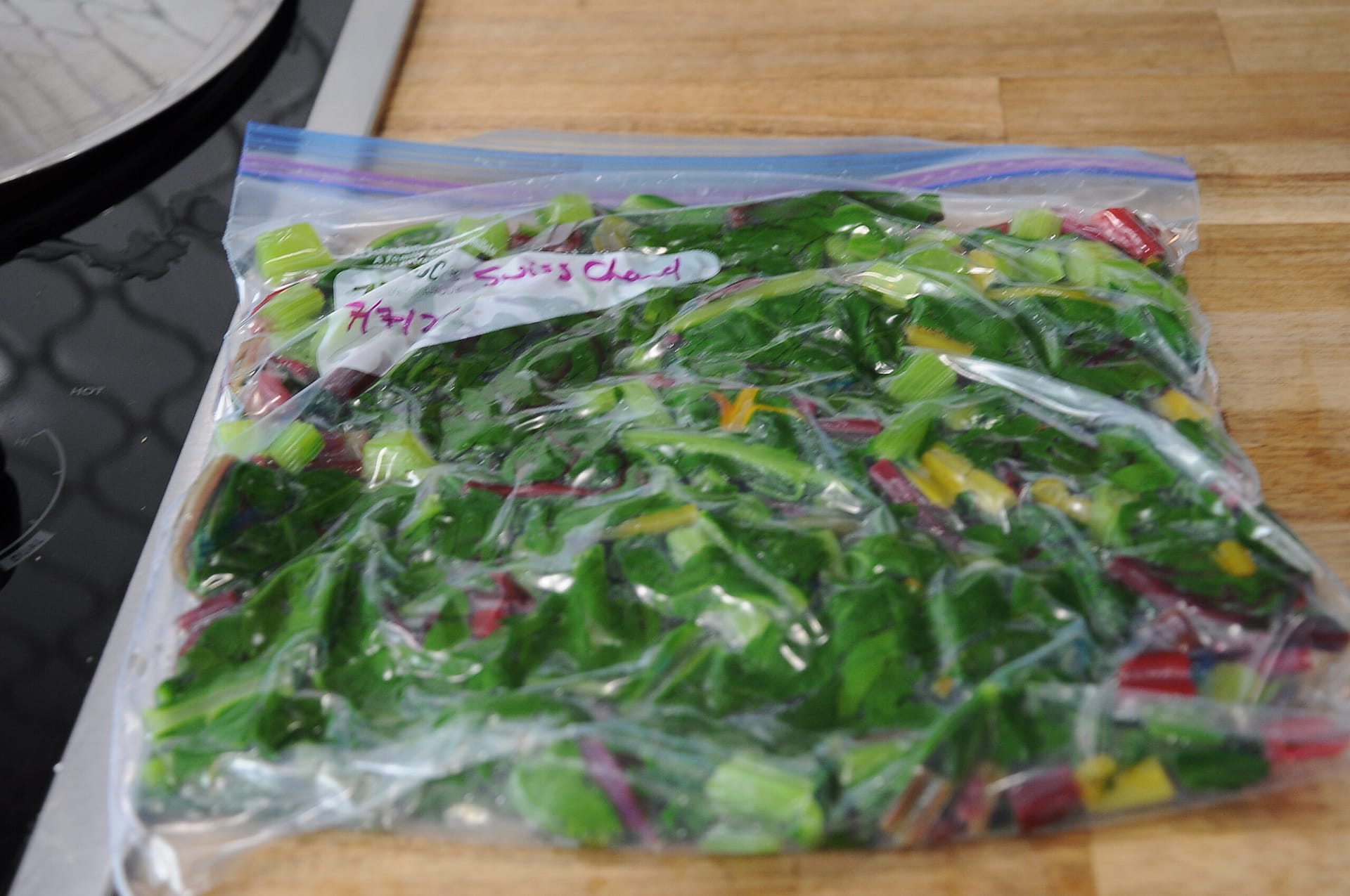 Swiss Chard bagged, labelled, with air removed, and ready to freeze